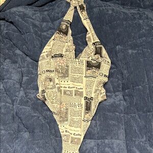Newspaper Print One-Piece bodysuit